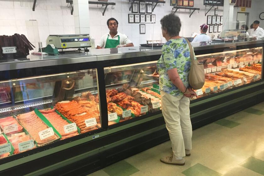 Specialties at the meat counter at Alpine Village Market include a wide variety of housemade sausages.