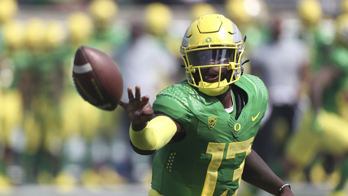 Oregon quarterback Anthony Brown (13) toss the ball against Fresno State 