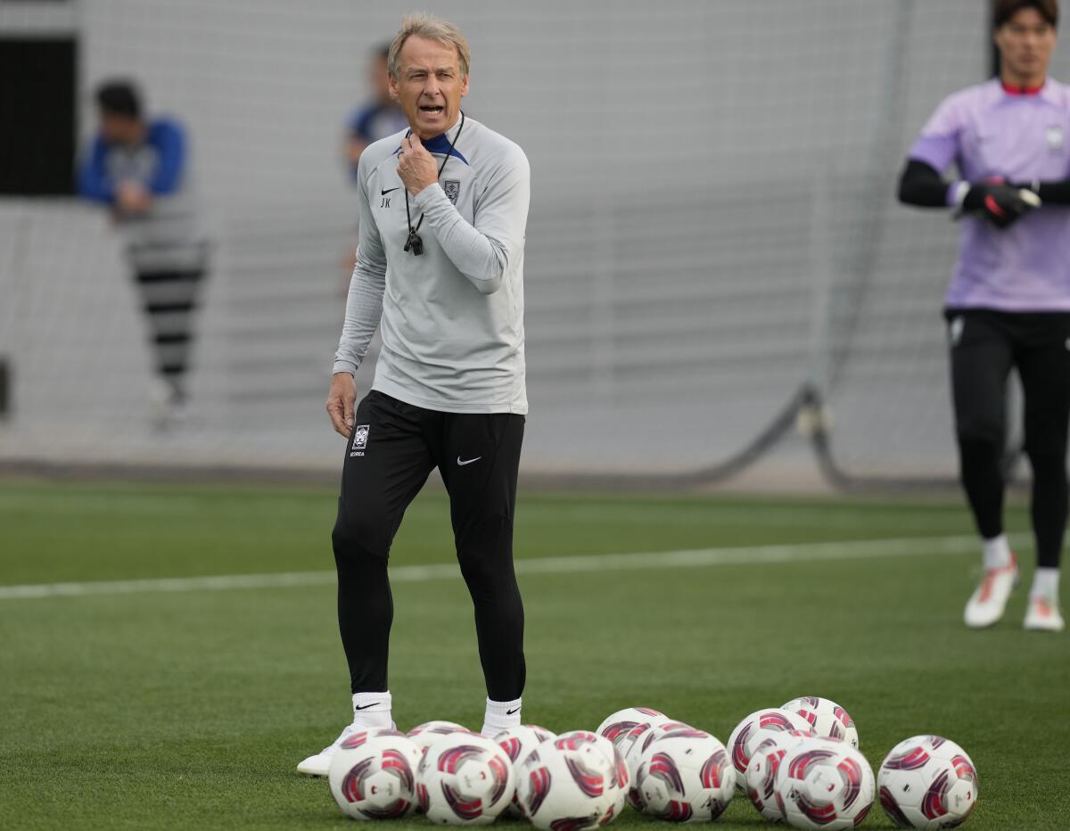 South Korea's head coach Jurgen Klinsmann speaks to his players during a training session of the national team in Doha, Qatar, Monday, Feb. 5, 2024. South Korea will play against Jordan for the semi final of the Asian Cup on Tuesday. (AP Photo/Thanassis Stavrakis)