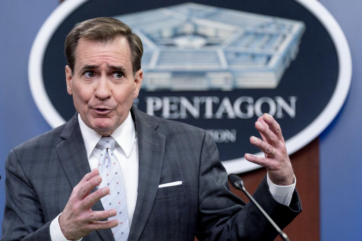 Pentagon spokesman John Kirby speaks at a podium.