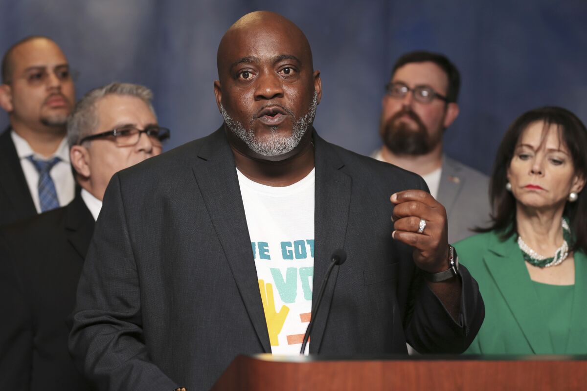 FILE - In this July 29, 2019, file photo, Desmond Meade, president of the Florida Rights Restoration Coalition, talks about Amendment 4 during a news conference at the Miami-Dade County State Attorney's Office in Miami. Meade, the Florida activist who led a movement to allow most former felons to vote, got more civil rights restored under a new state clemency program, Meade announced in a Twitter video posted Saturday, Oct. 9, 2021. (Sam Navarro/Miami Herald via AP, File)