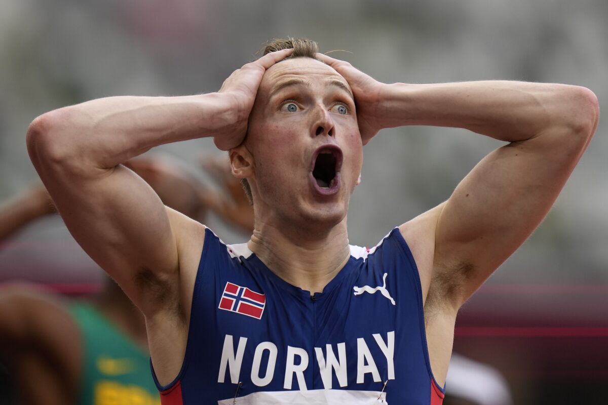 Karsten Warholm, of Norway, reacts after winning the men's 400-meter hurdles final at the 2020 Summer Olympics, Tuesday, Aug. 3, 2021, in Tokyo. (AP Photo/Petr David Josek)