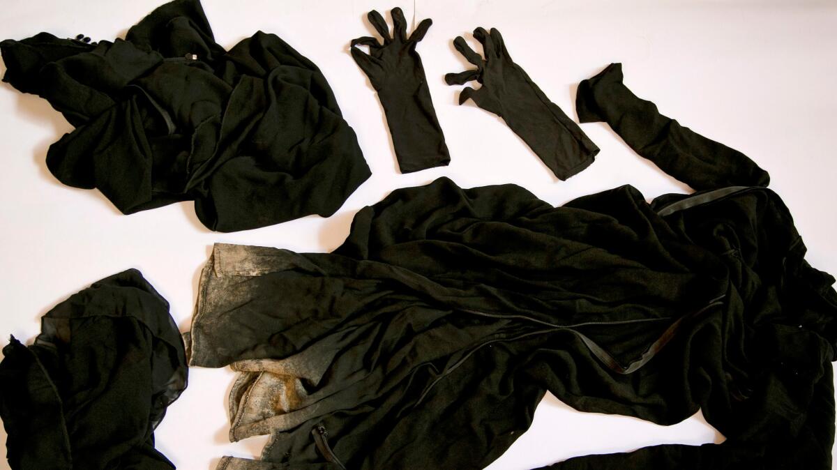 Clothing worn by a Yazidi girl enslaved by militants, collected by a Yazidi activist to document Islamic State group crimes against the community.