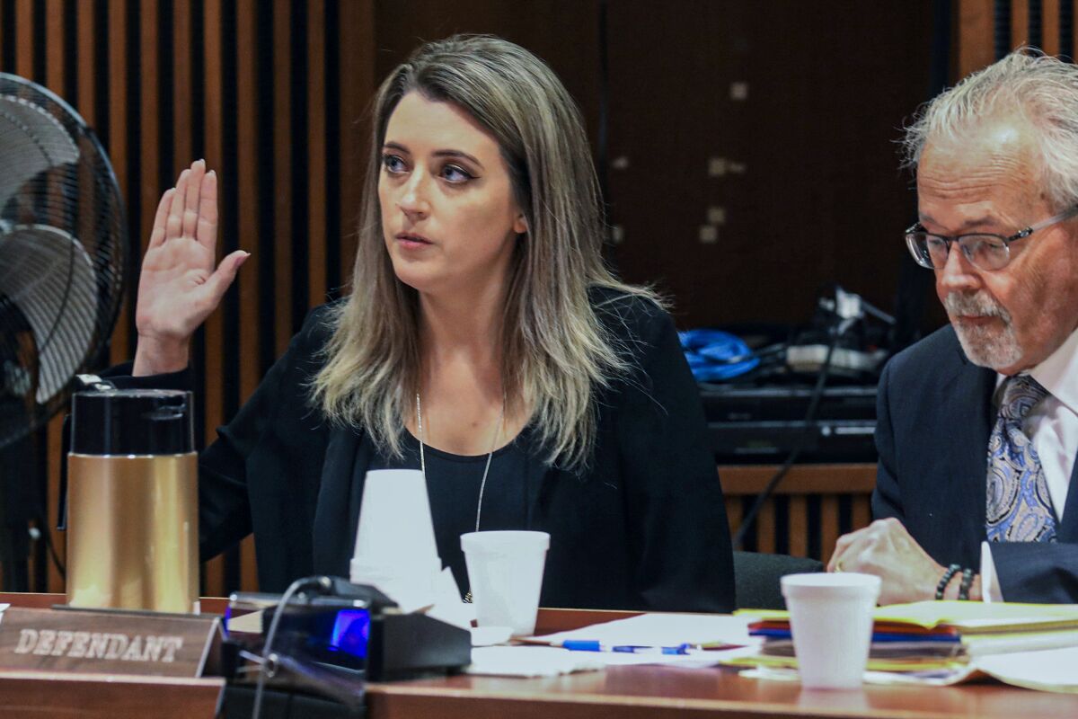 FILE - Kate McClure, 29, charged with theft by deception in the $400,00 GoFundMe scam, with her lawyer Jim Gerrow Jr., in State Superior Court, Burlington County Courthouse, Mt. Holly, N.J., April 15, 2019. A New Jersey judge sentenced McClure to a term of one year and one day in prison, for her role in the scam using a fake story about Johnny Bobbitt who was a homeless veteran. (David Swanson/The Philadelphia Inquirer via AP, File)