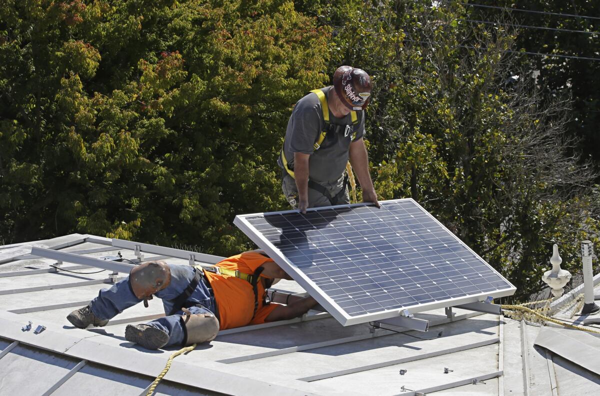 A solar panel is installed on the roof of the Old Governor's Mansion State Historic Park on Oct. 16, 2015, in Sacramento as part of the renovation of the building.