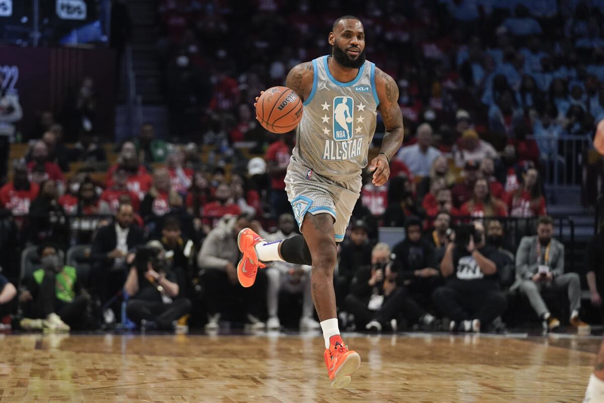 Lakers' LeBron James drives down the court during the second half of the NBA All-Star game.