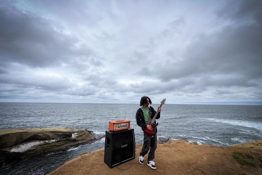 San Diego, California - May 15: Local musician Sadie Hellfire, 26, records a music video for the song "Quiet" at Sunset Cliffs on Wednesday, May 15, 2024 in San Diego, California. Hellfire produced and recorded his latest EP called "Know" himself. (Ana Ramirez / The San Diego Union-Tribune)