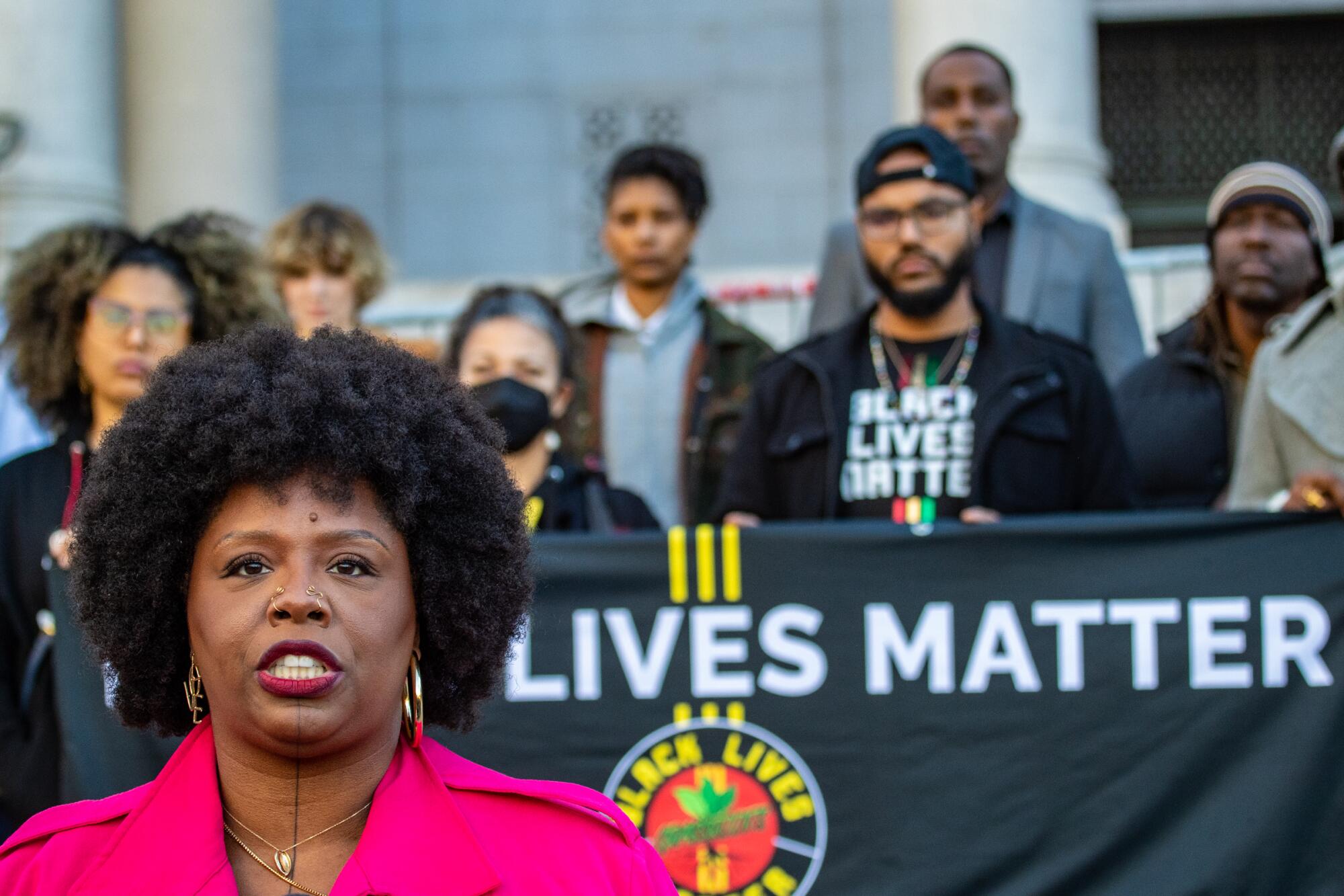 Patrisse Cullors speaks at a press conference on the steps of City Hall in Jan. 2023 in Los Angeles.