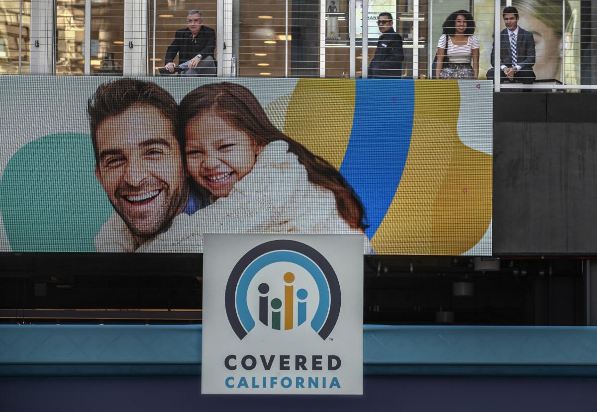 A Covered California sign on the side of a building