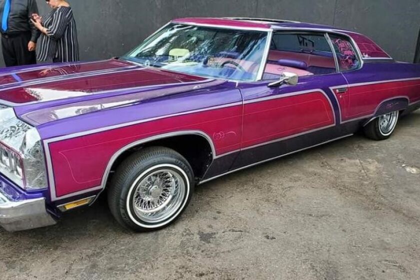 The author's pink and purple ’73 Impala.