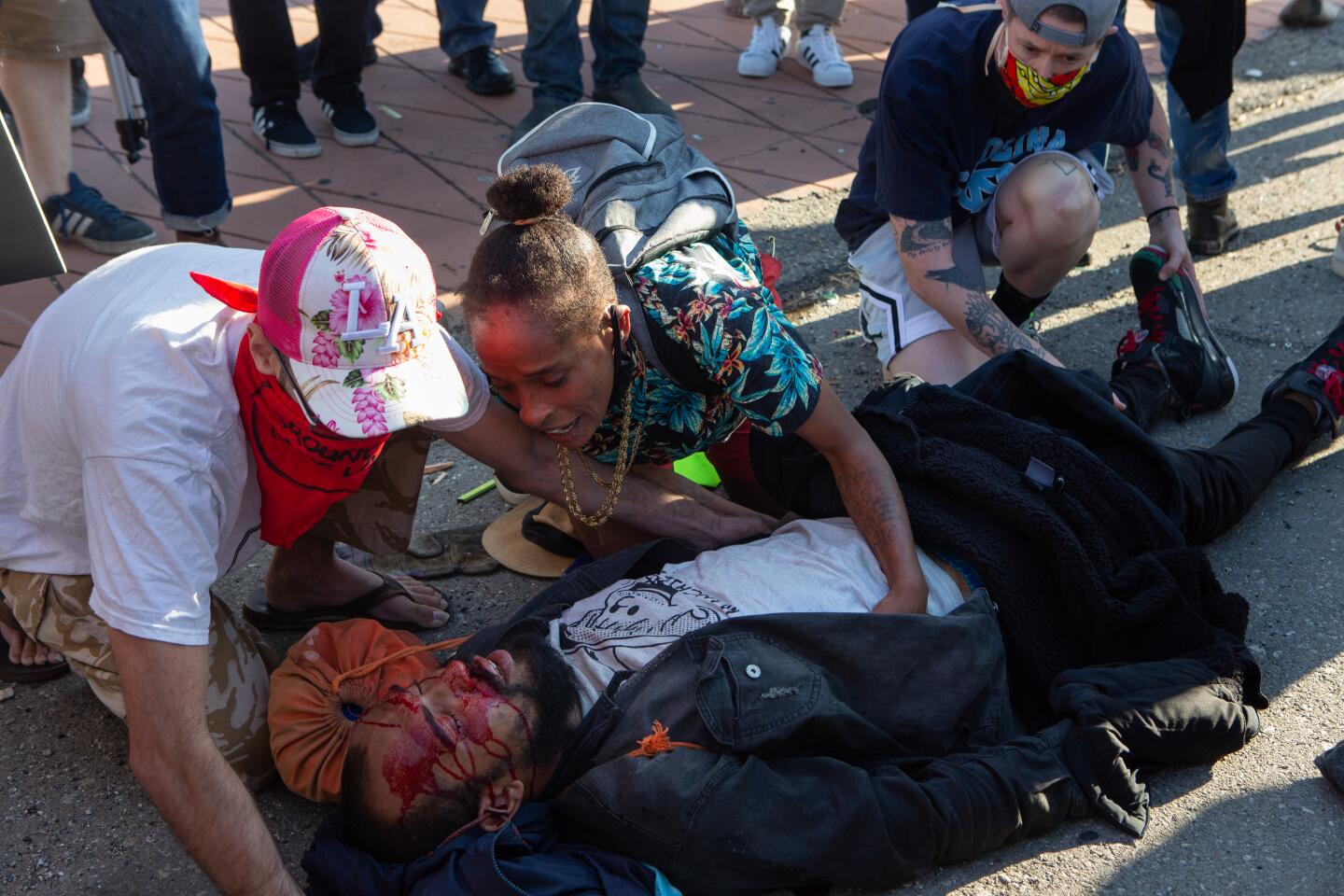 A protester lies hurt on the 101 Freeway near downtown Los Angeles on May 27.