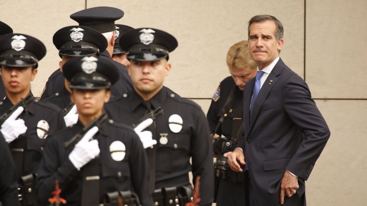 Mayor Eric Garcetti, conducting inspection of recruits at a 2016 Los Angeles Police Department graduation ceremony, helped usher Charter Amendment C, an LAPD discipline measure, onto the ballot.