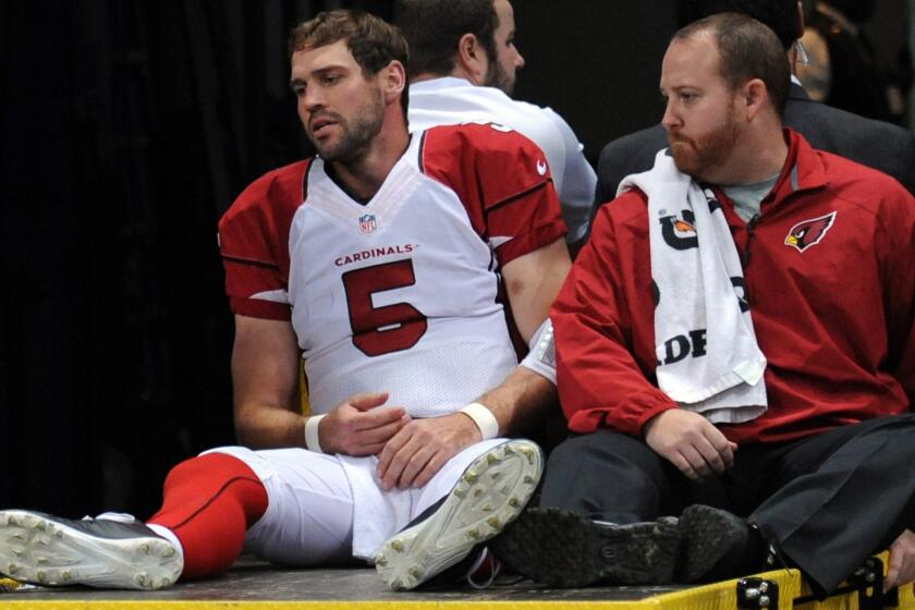 Arizona Cardinals quarterback Drew Stanton is carted off the field after suffering a partially torn anterior cruciate ligament and a sprained medial collateral ligament in the same knee Thursday against the St. Louis Rams.