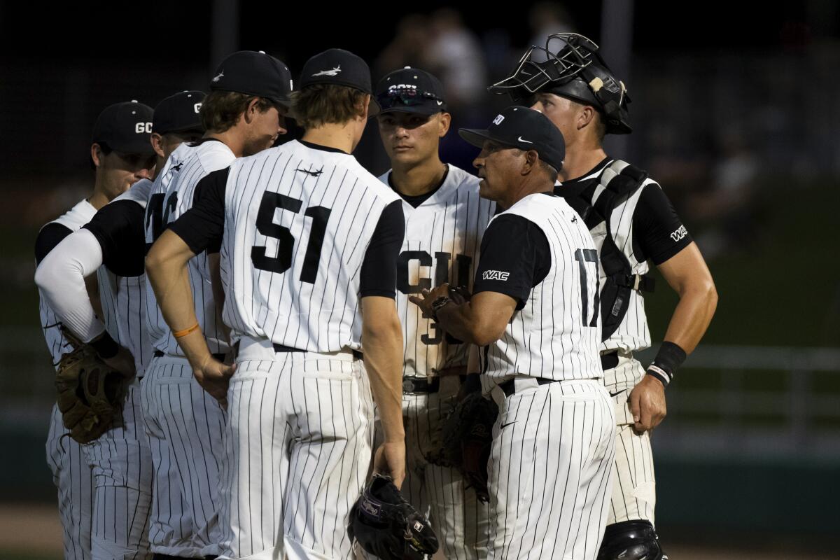 Grand Canyon baseball players in a huddle.