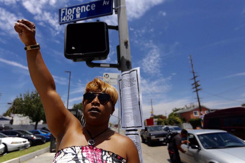 Jelecia Smith, 23, of Los Angeles, felt compelled to join a small protest at Florence and Normandie in Los Angeles on July 9.