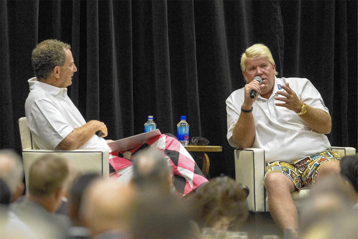 John Daly, right, answers questions from Hank Adler, the Toshiba Classic chairman emeritus during the annual Breakfast With A Champion event for the Toshiba Classic on Tuesday.