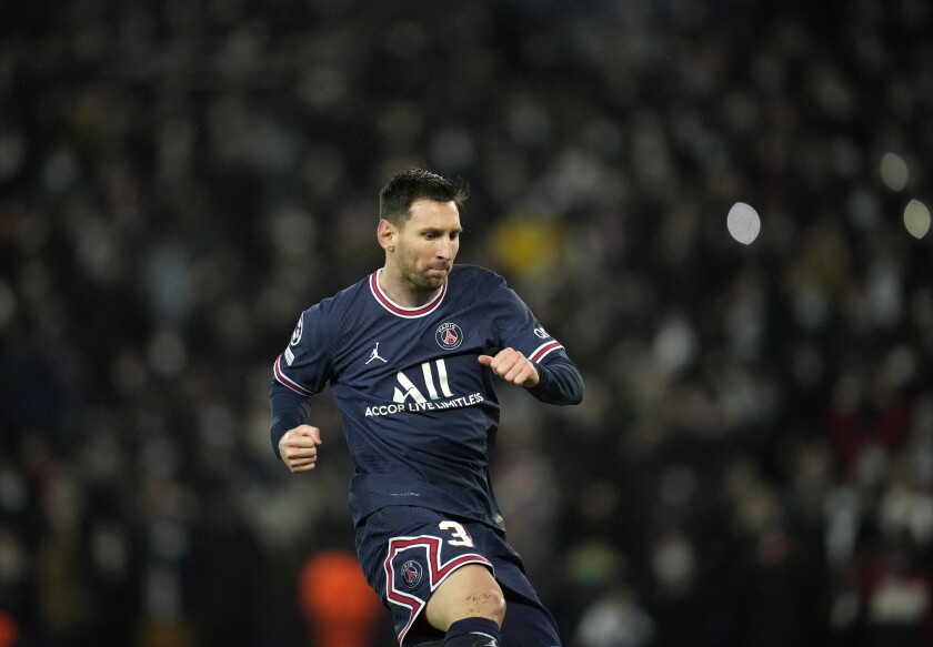 PSG's Lionel Messi celebrates after scoring his side's fourth goal during the Champions League Group A soccer match between PSG and Club Brugge at the Parc des Princes stadium in Paris, France, Tuesday, Dec. 7, 2021. (AP Photo/Christophe Ena)