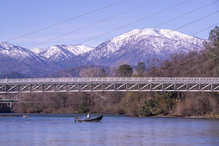 A man is fishing on the Sacramento River in Redding.