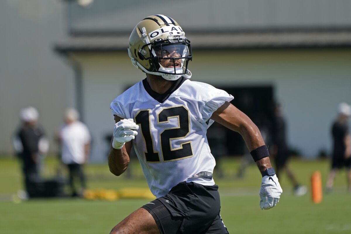 New Orleans Saints wide receiver Chris Olave (12) works out during the NFL football team's rookie minicamp in Metairie, La., Saturday, May 14, 2022. (AP Photo/Gerald Herbert)