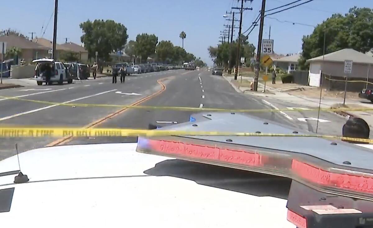 Investigators at the scene of a street takeover.