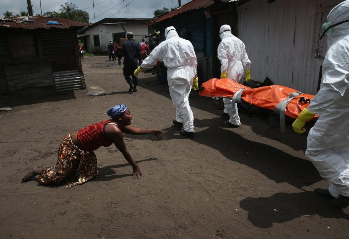 A Liberian woman crawls toward the body of her sister, who died of Ebola. The only suffering readers of news articles are asked to accept is that of knowing.