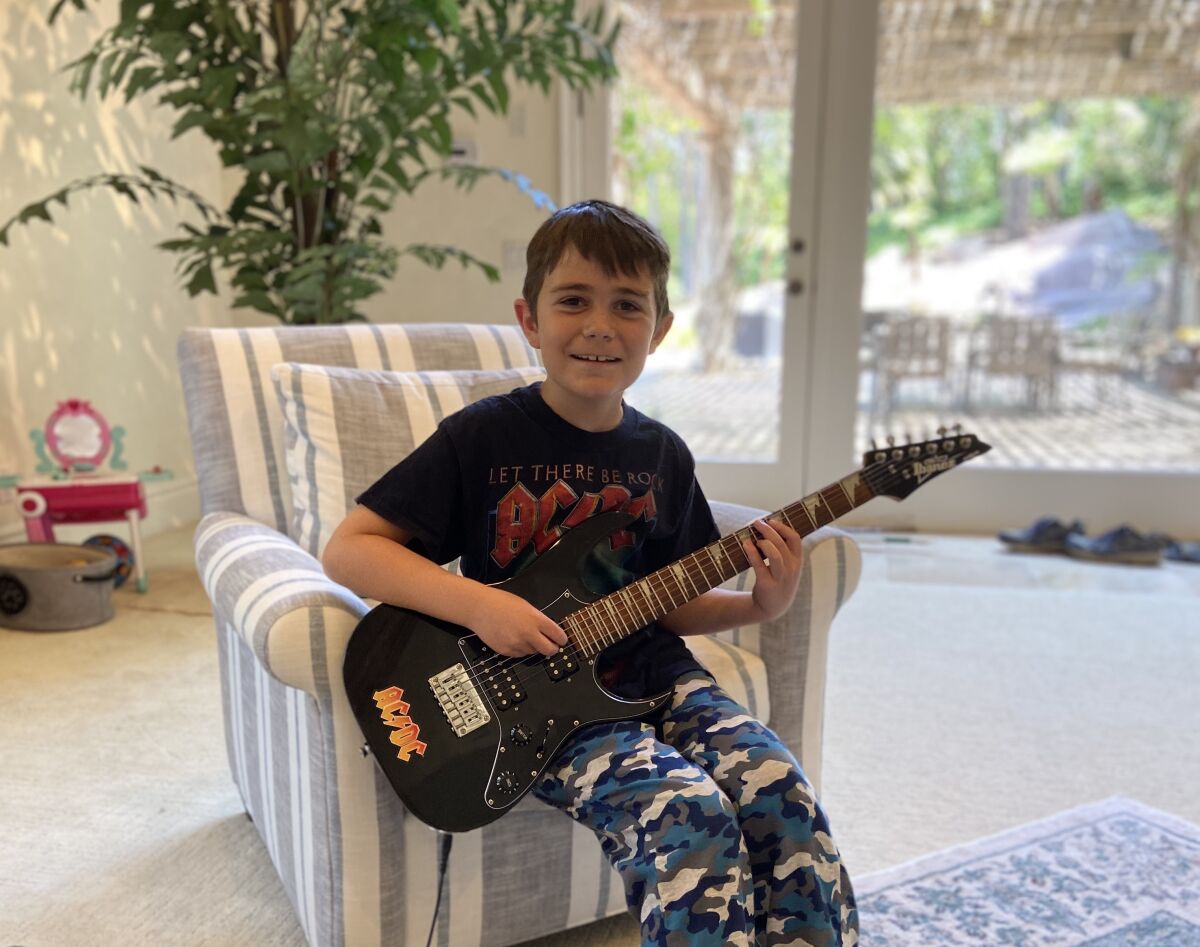 Sage Canyon third grader Austin played Green Day's "Holiday" on his electric guitar in the virtual talent show.