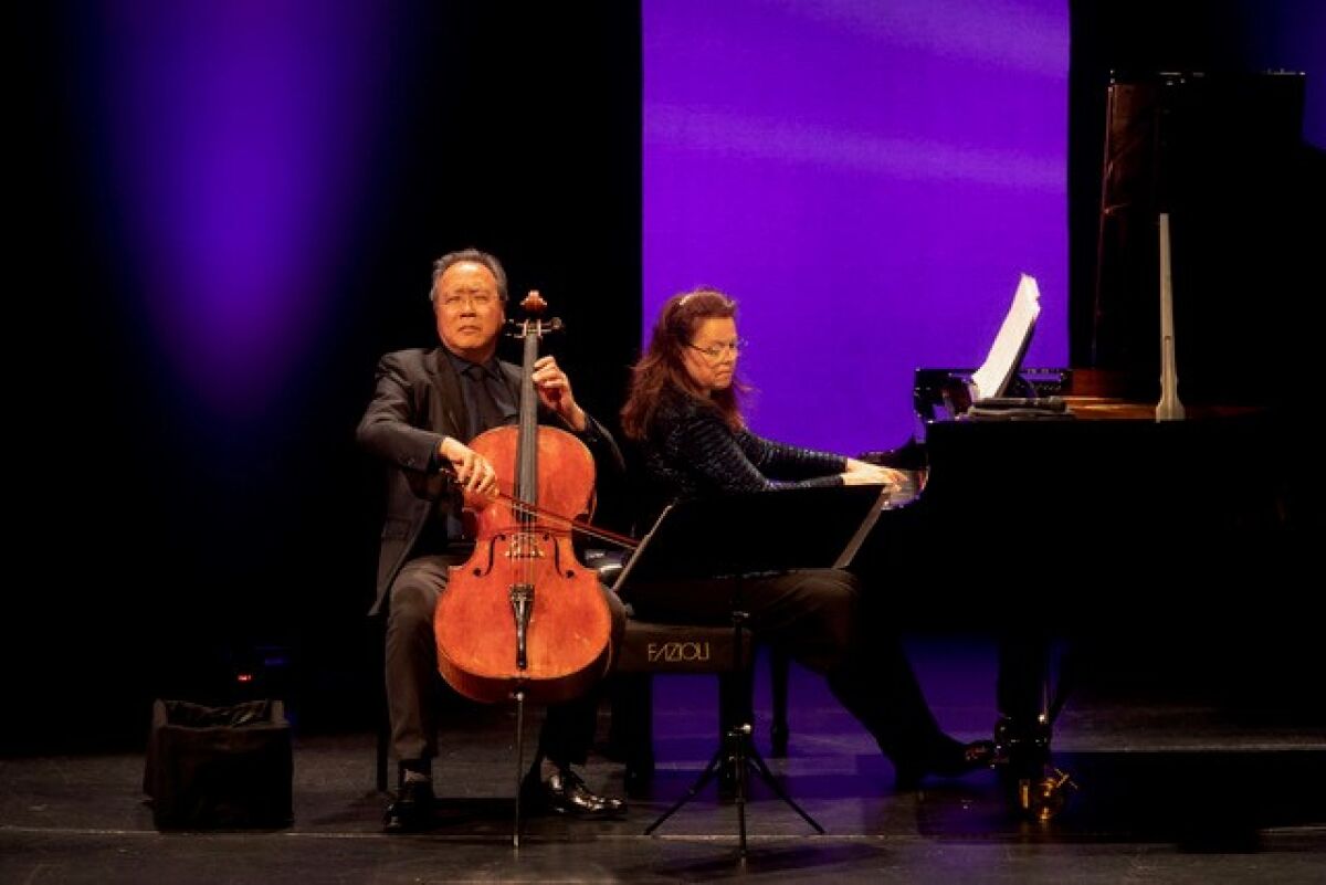 Yo-Yo Ma plays the cello as musical partner Kathryn Stott plays the piano.