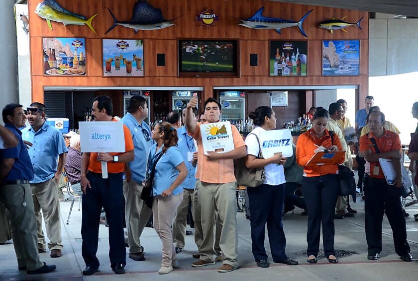 Tour guides and drivers await arrivals at the Los Cabos International Airport in 2015. 