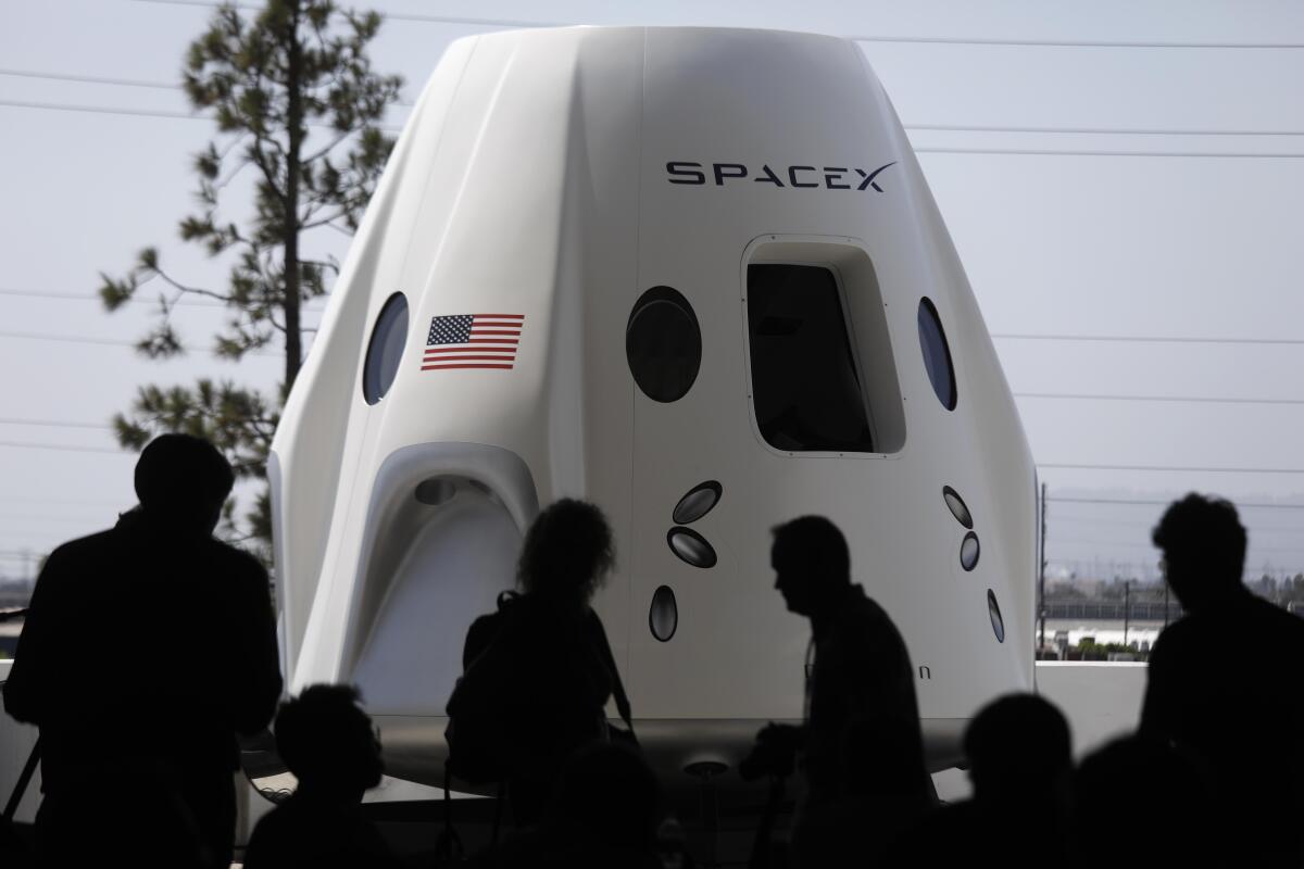 A prototype of the Crew Dragon spacecraft on display at SpaceX in Hawthorne, Calif.