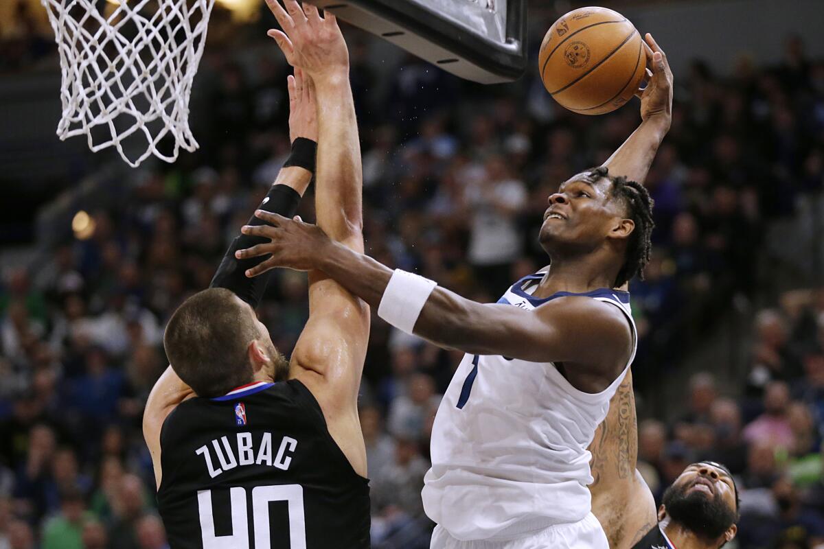 Anthony Edwards shoots against Clippers center Ivica Zubac.