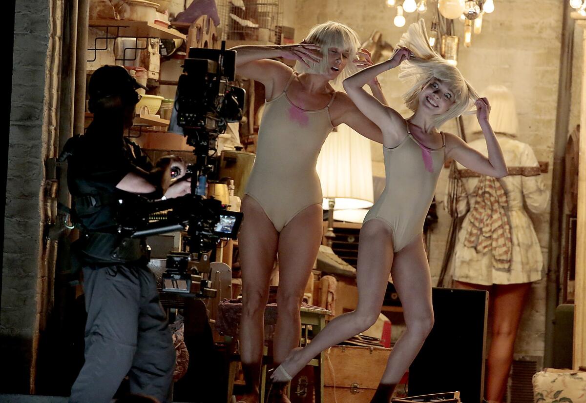 Kristen Wiig and dancer Maddie Ziegler perform to Sia's "Chandelier."