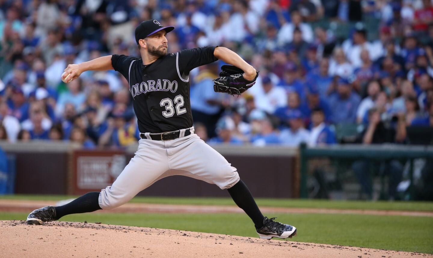 Colorado Rockies starting pitcher Tyler Chatwood delivers to the Cubs in the first inning.