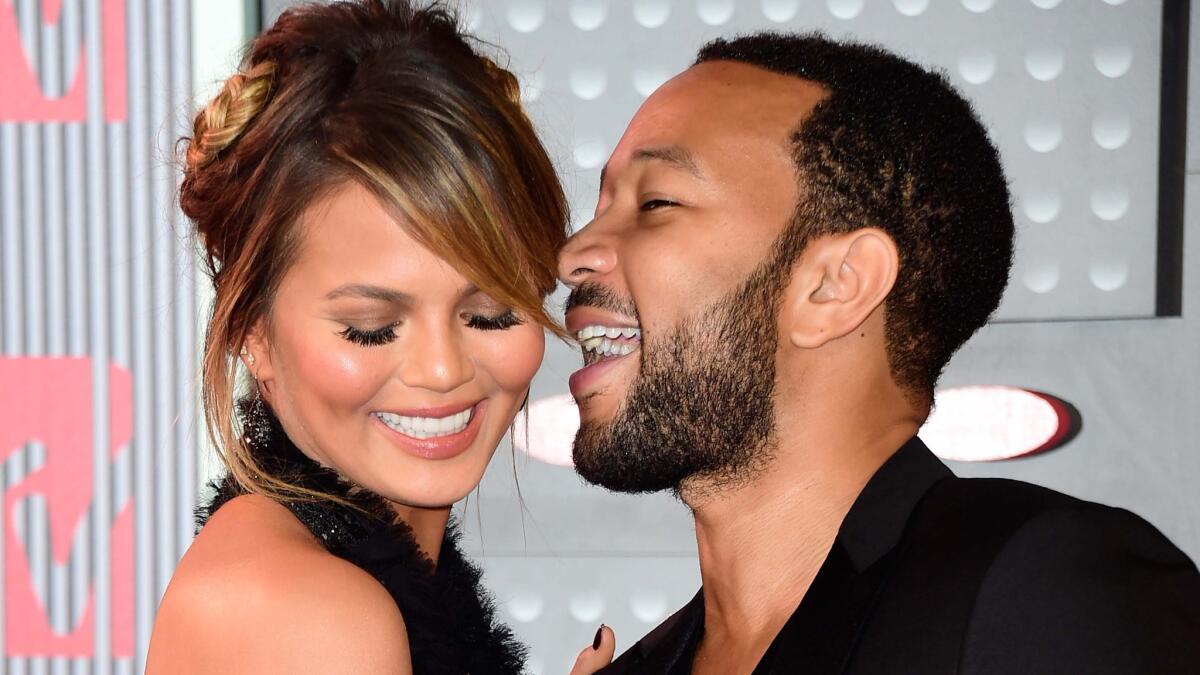 Chrissy Teigen and John Legend shared a secret with the world Monday evening: They're expecting a baby.