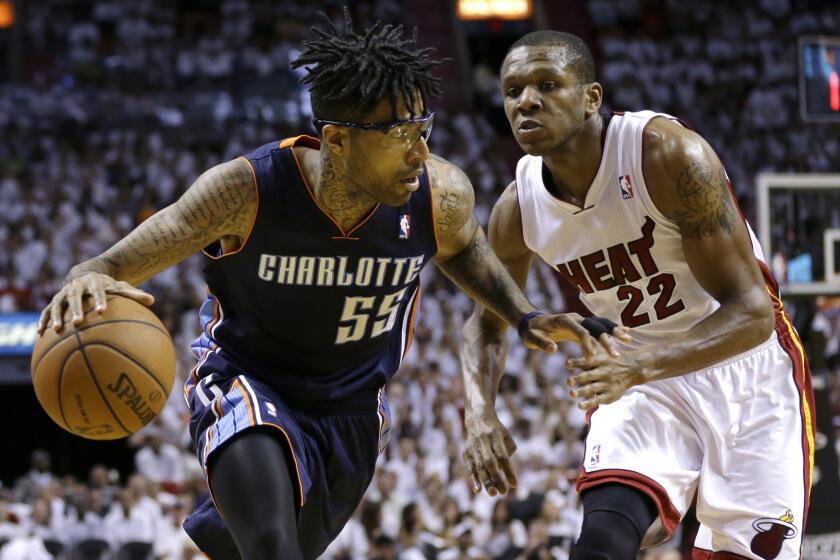 Charlotte's Chris Douglas-Roberts, left, drives past Miami's James Jones during a playoff game in April. Douglas-Roberts signed a one-year deal with the Clippers on Wednesday.