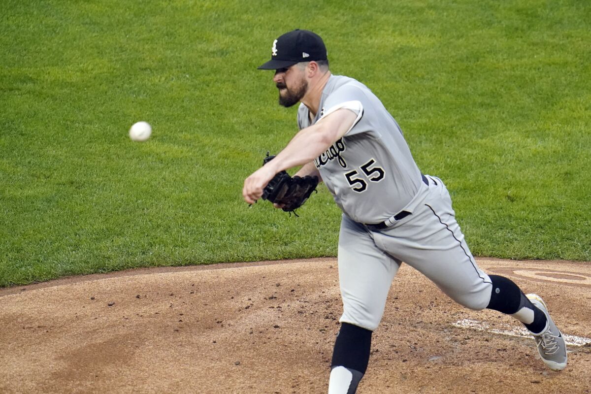 Chicago White Sox pitcher Carlos Rodon throws against the Minnesota Twins in the first inning of a baseball game Tuesday, July 6, 2021, in Minneapolis. (AP Photo/Jim Mone)