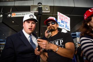 Trump supporters Omar Navarro (L) and Harim Uzziel live stream their counter-protest of the executive order by US President Donald Trump, banning immigrants from seven majority-Muslim countries at Los Angeles International Airport in Los Angeles, California, February 4, 2017. / AFP / Kyle Grillot (Photo credit should read KYLE GRILLOT/AFP via Getty Images)