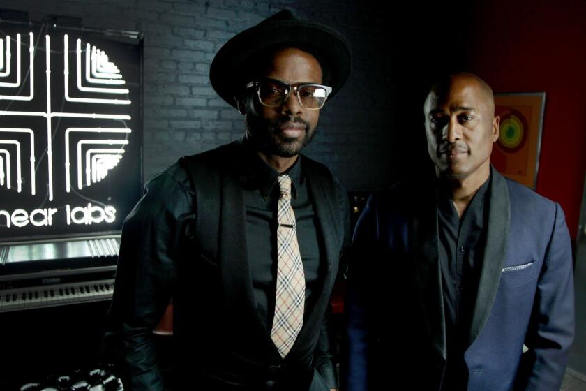 HIGHLAND PARK, CA., JUNE 16, 2018--Producer Adrian Younge and Ali Shaheed Muhammad (or A Tribe Called Quest) at Adrian's studio in Highland Park. The two musicians just completed work on the score for the new season of Marvel's "Luke Cage," and just released a new studio album as well. (Kirk McKoy / Los Angeles Times)