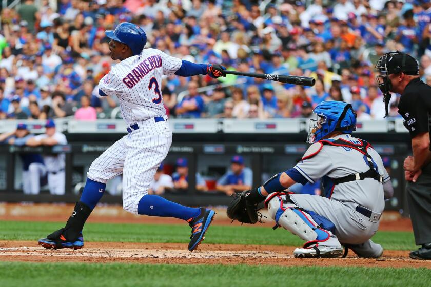 The Mets' Curtis Granderson hits a first-inning home run against the Los Angeles Dodgers on Saturday at Citi Field. The Mets had three homers in the inning.