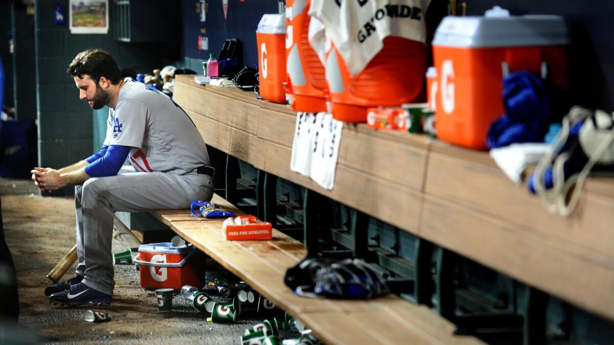 Brandon Morrow sits alone in the dugout after surrendering the lead against the Houston Astros in Game 5 of the World Series at Minute Maid Park. Morrow signed with the Chicago Cubs in the offseason.