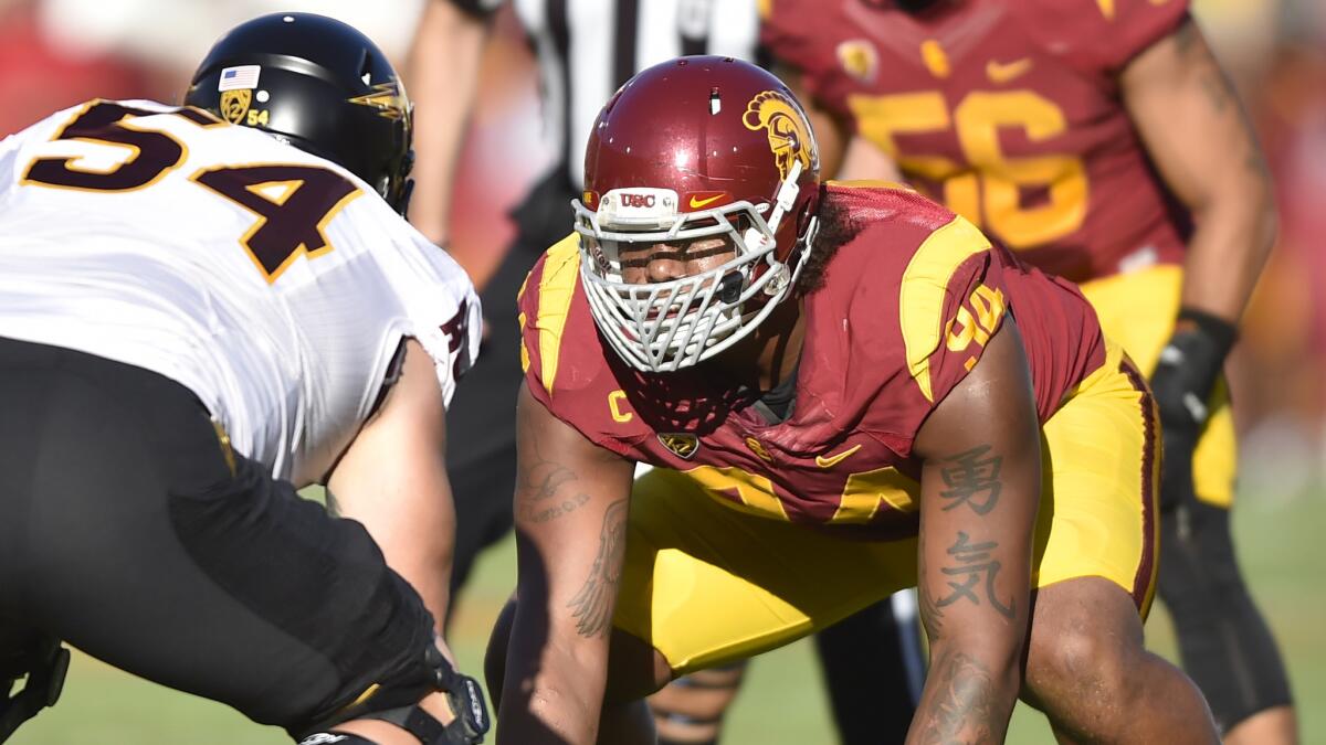 USC defensive end Leonard Williams lines up against Arizona State offensive lineman Tyler Sulka during the Trojans' loss at the Coliseum on Oct. 4.