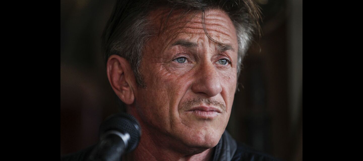 Sean Penn looks out over the crowd just before he reads from his new book 'Bob Honey Who Just Do Stuff'.