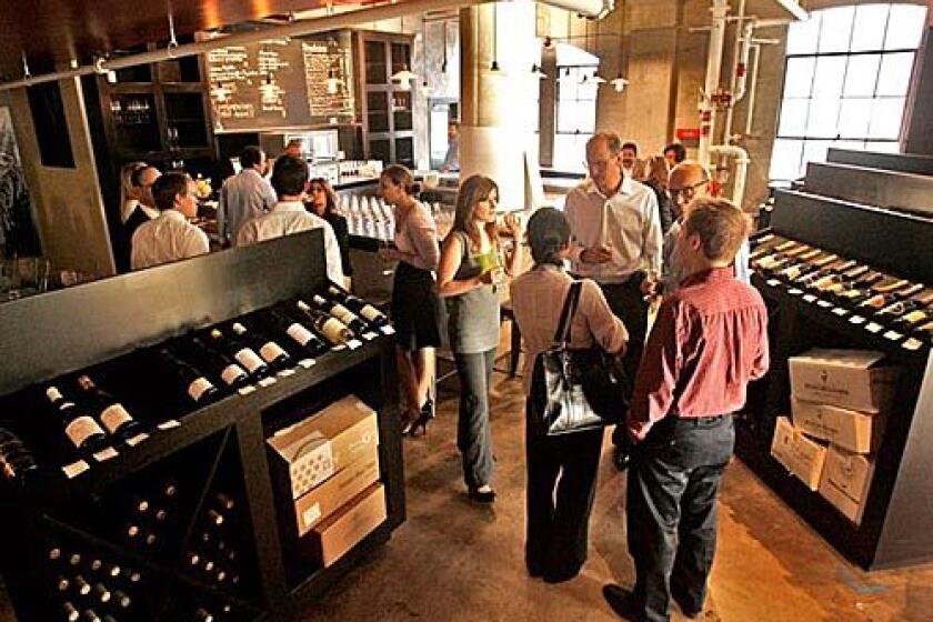 A wine-tasting group in the wine shop of Palate Food + Wine in Glendale, a restaurant, wine bar and wine shop.