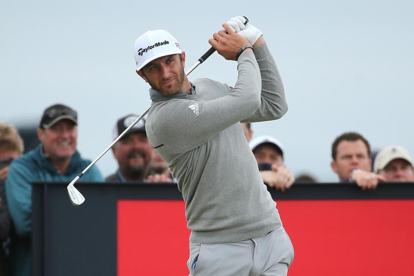 Dustin Johnson tees off on the 16th hole Thursday during the first round of the British Open at St. Andrews.