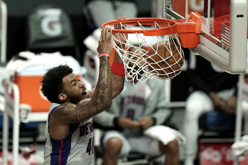 Detroit Pistons' Saddiq Bey makes a dunk against the Los Angeles Clippers during the first half of an NBA basketball game Sunday, April 11, 2021, in Los Angeles. (AP Photo/Jae C. Hong)