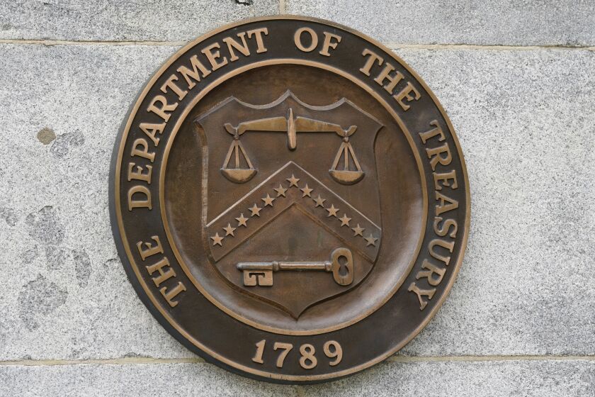 FILE - The Department of the Treasury's seal outside the Treasury Department building in Washington on May 4, 2021. The national debt is at the core of a dispute about how to raise the government's legal borrowing authority, which could come to a head this summer if the government runs out of accounting maneuvers to keep paying its bills. (AP Photo/Patrick Semansky, File)