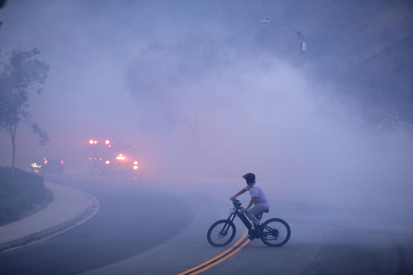 A cyclist amid smoke