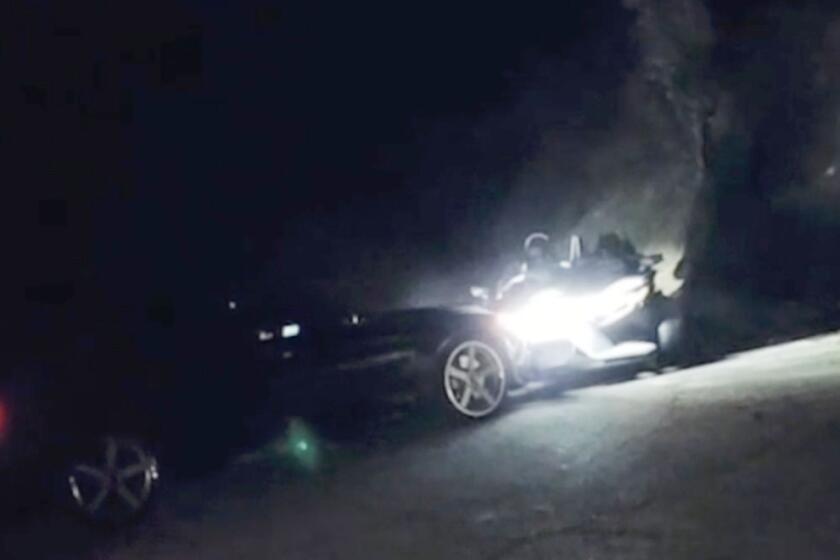 Video showed someone driving a Polaris Slingshot through a darkened road at night, blasting hip-hop music. The video cuts to someone doing donuts in the vehicle while another person films it. The next scene shows a BMW slamming into the front of the Slingshot. The man filming it says "oops." =