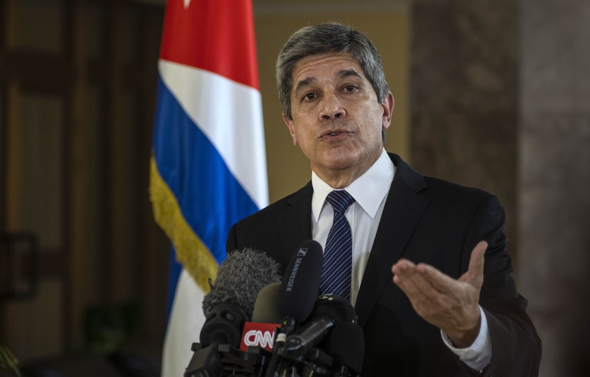 Cuba's Director General of U.S. Affairs Carlos Fernandez de Cossio speaks at a press conference in Havana, Cuba, Tuesday, Jan. 12, 2021. The Trump administration has re-designated Cuba as a "state sponsor of terrorism" in a move that hits the country with new sanctions shortly before President-elect Joe Biden takes office. (AP Photo/Ramon Espinosa)