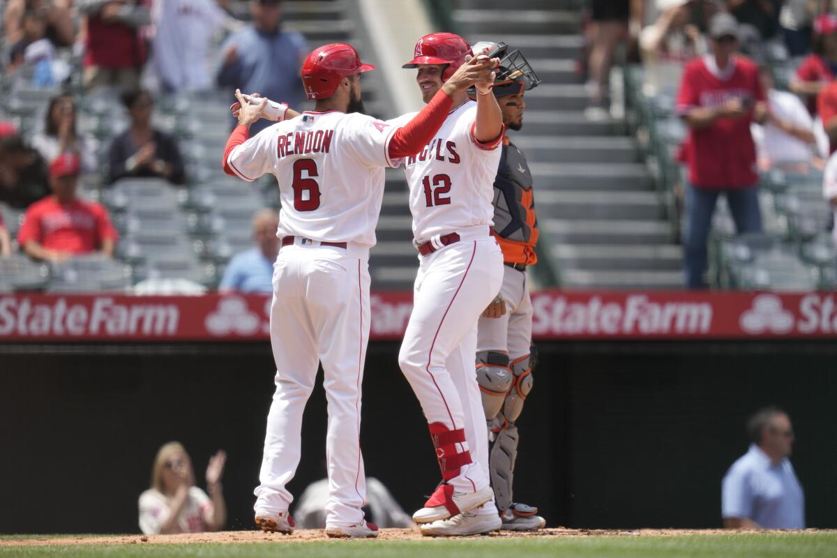 Anthony Rendon and Hunter Renfroe of the Angels celebrate after Renfroe's home run.