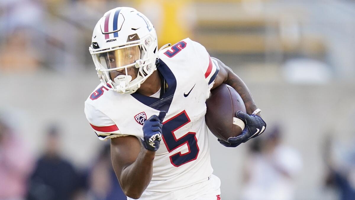 Arizona wide receiver Dorian Singer runs with the ball after making a catch against Cal on Sept. 24.